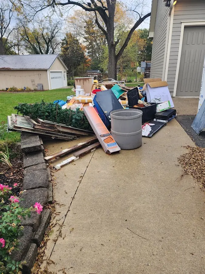 Dumpster being loaded with debris for 10 Yard Dumpster Rental in Putnam Valley
